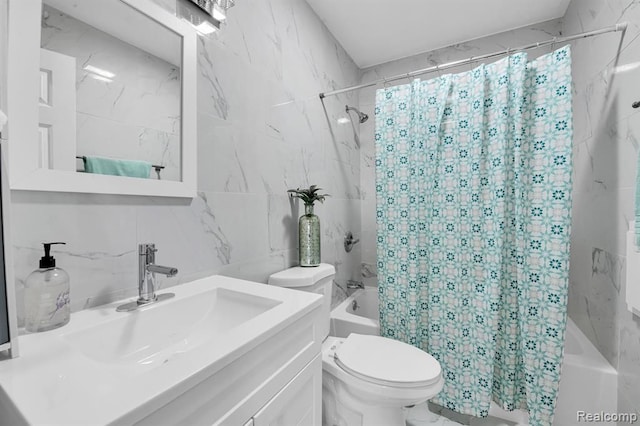 full bathroom featuring vanity, tile walls, shower / bathtub combination with curtain, and toilet