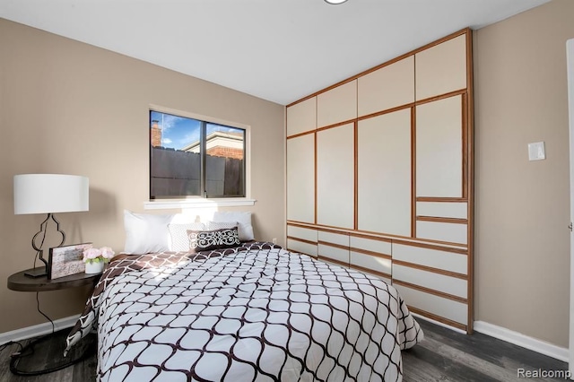 bedroom featuring dark hardwood / wood-style floors