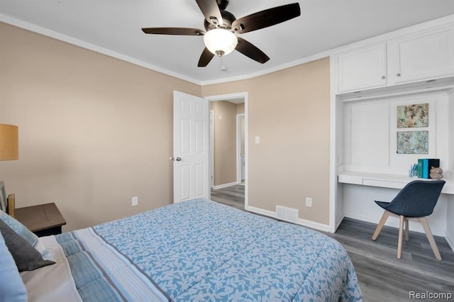 bedroom with crown molding, ceiling fan, and hardwood / wood-style floors