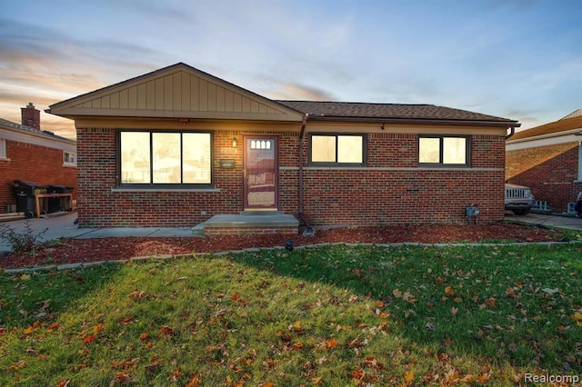 view of front of house with a yard