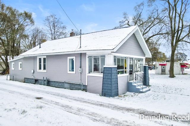 view of snow covered house