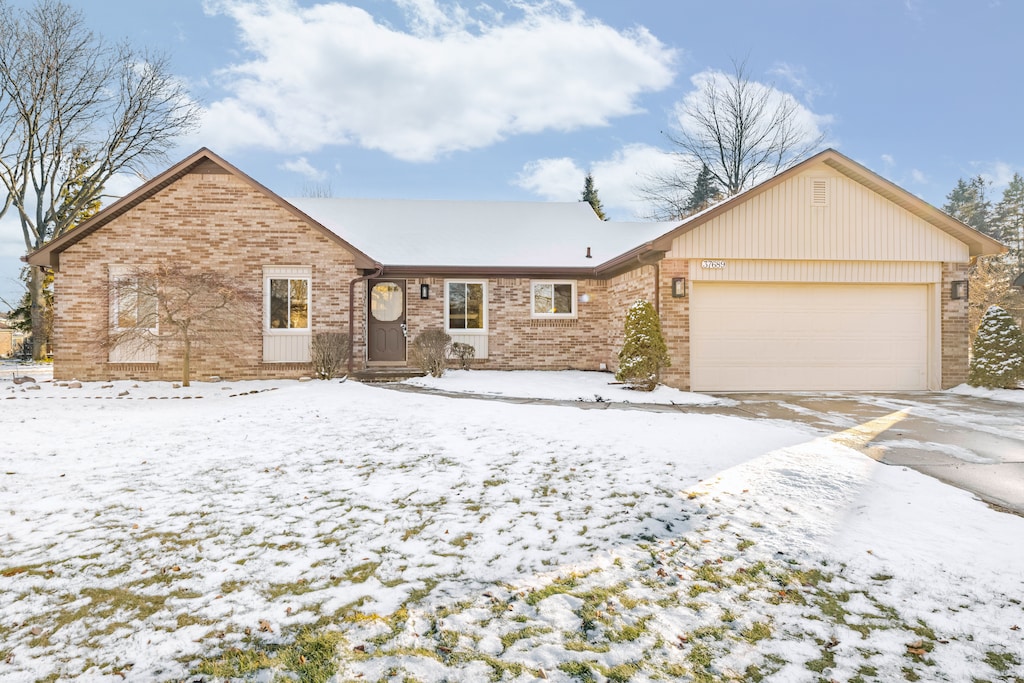 ranch-style house featuring a garage