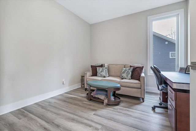 office space with light hardwood / wood-style flooring