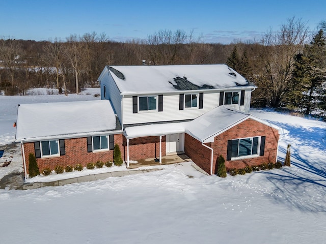 traditional-style home with brick siding