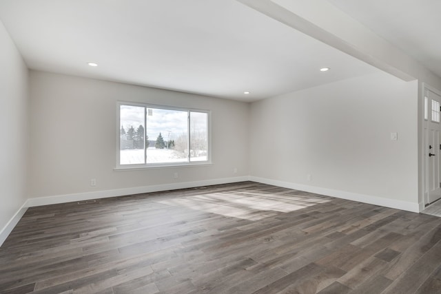 interior space featuring dark wood-style floors, recessed lighting, and baseboards