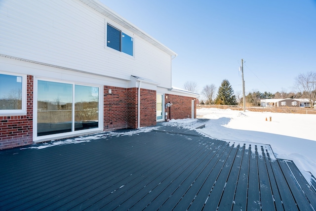 view of snow covered deck