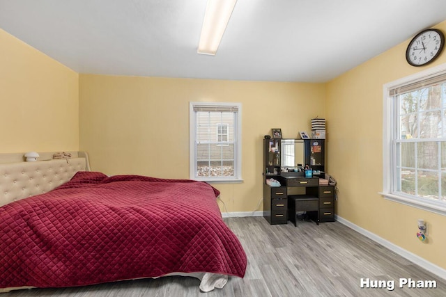 bedroom featuring light wood-type flooring