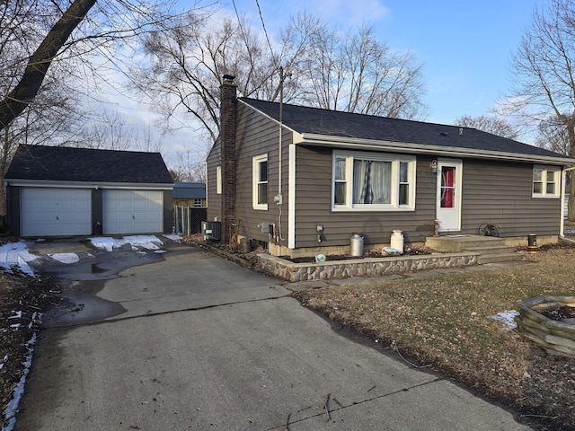 view of front of property with an outbuilding and a garage