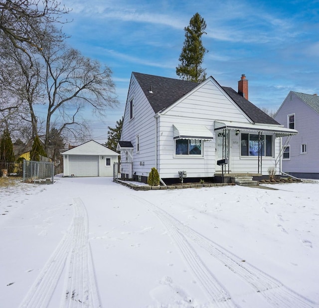 view of front of property featuring an outbuilding and a garage