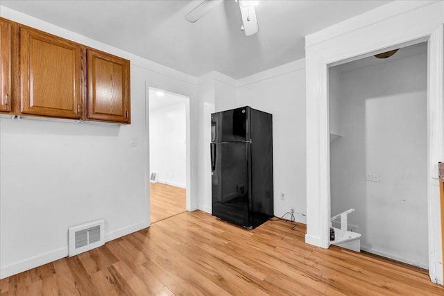 interior space with ceiling fan and light wood-type flooring