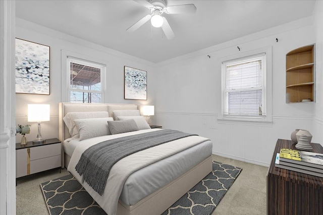 bedroom featuring ceiling fan and light carpet