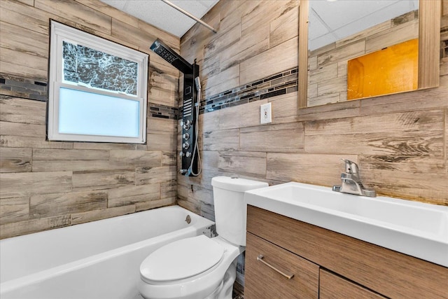 full bathroom with tiled shower / bath combo, vanity, and toilet