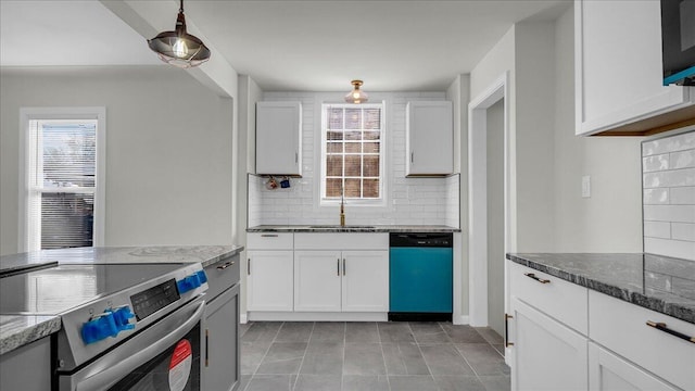 kitchen featuring appliances with stainless steel finishes, sink, and white cabinets