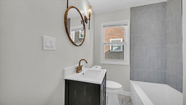 bathroom with tile patterned floors, vanity, and toilet