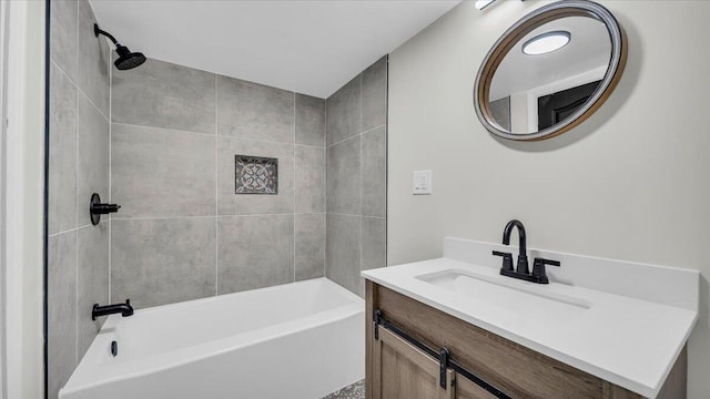 bathroom with vanity and tiled shower / bath combo