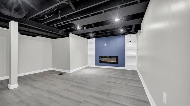 basement featuring wood-type flooring