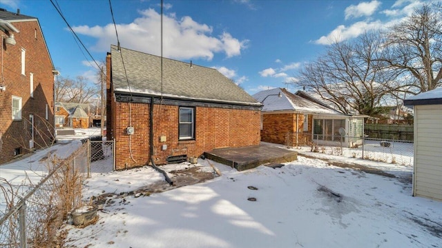 view of snow covered house