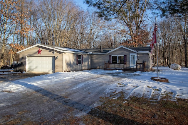 ranch-style house featuring a garage