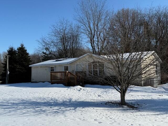 view of front of property with a wooden deck