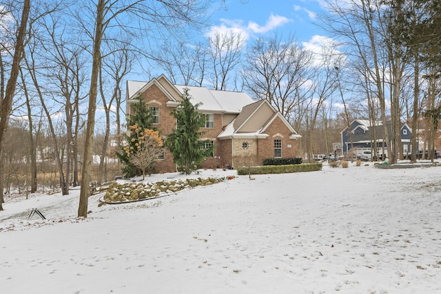 traditional-style house with brick siding