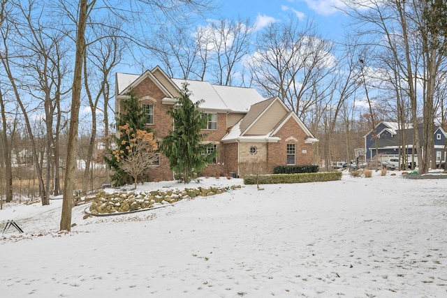 traditional-style house featuring brick siding