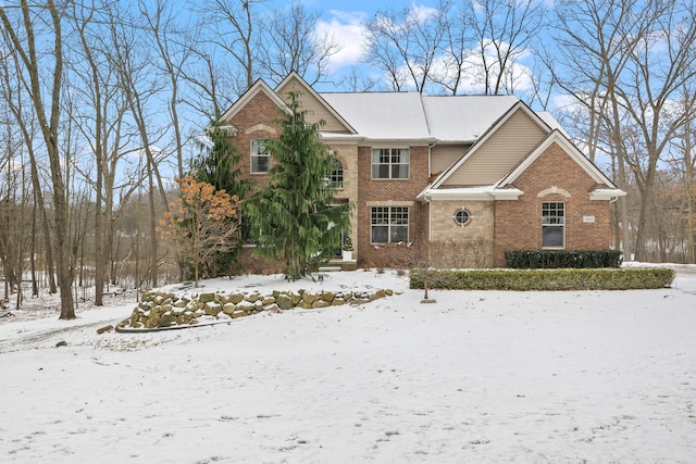 traditional-style home with brick siding