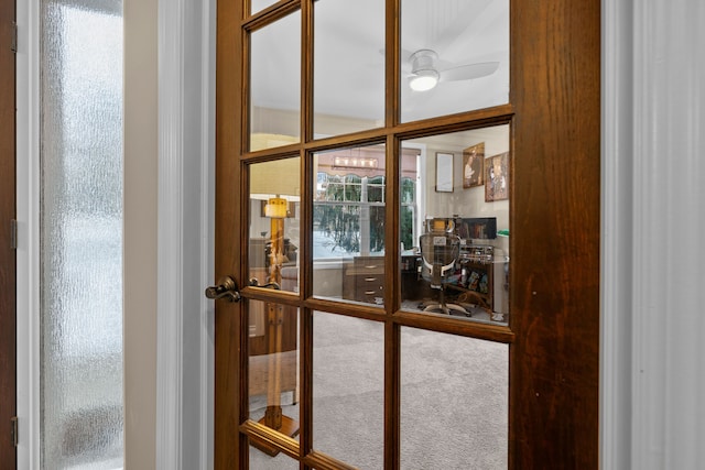 doorway to outside with carpet floors