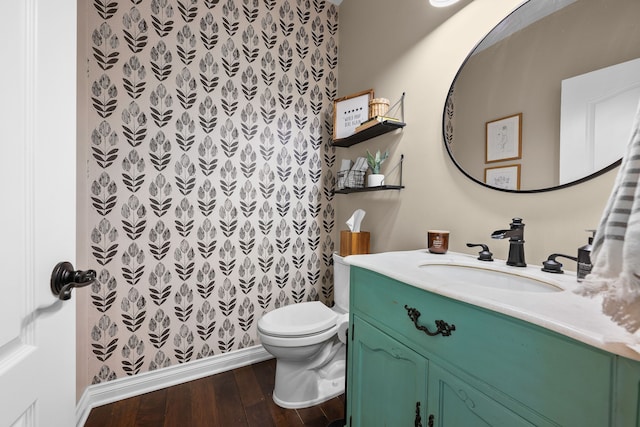 full bath with vanity, toilet, and wood finished floors