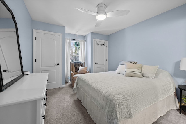 bedroom with ceiling fan and light colored carpet