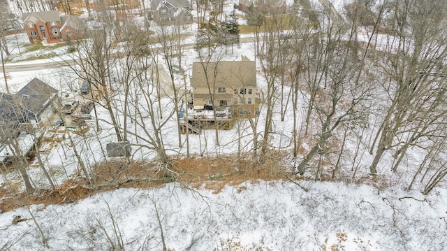 snowy aerial view featuring a residential view