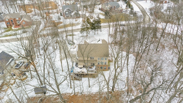 snowy aerial view featuring a residential view