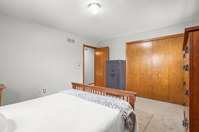 carpeted bedroom featuring a closet