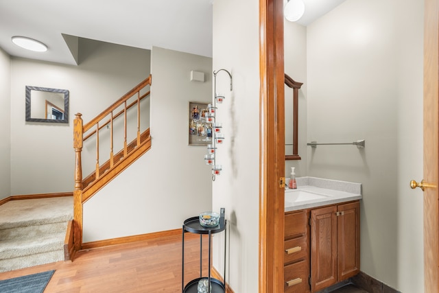 bathroom with vanity and wood-type flooring