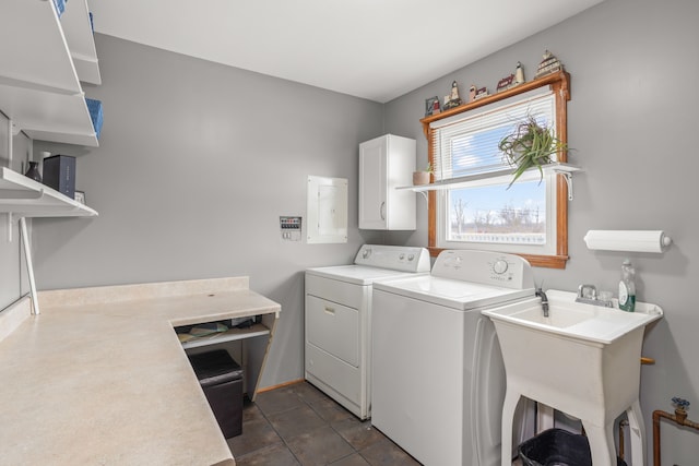 clothes washing area with sink and washing machine and clothes dryer