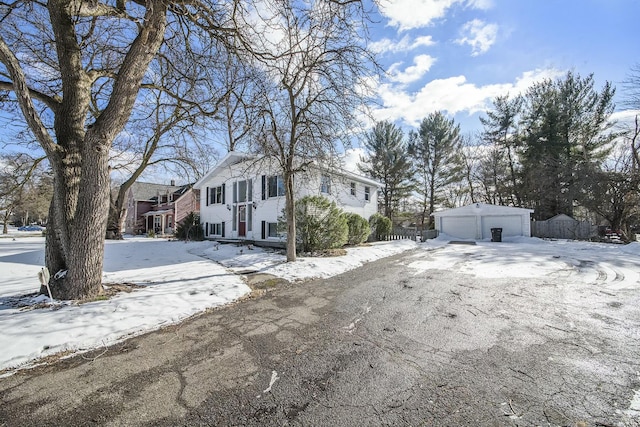 view of front of house featuring a garage and an outdoor structure