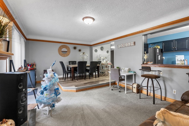 carpeted living area with a textured ceiling, crown molding, and baseboards