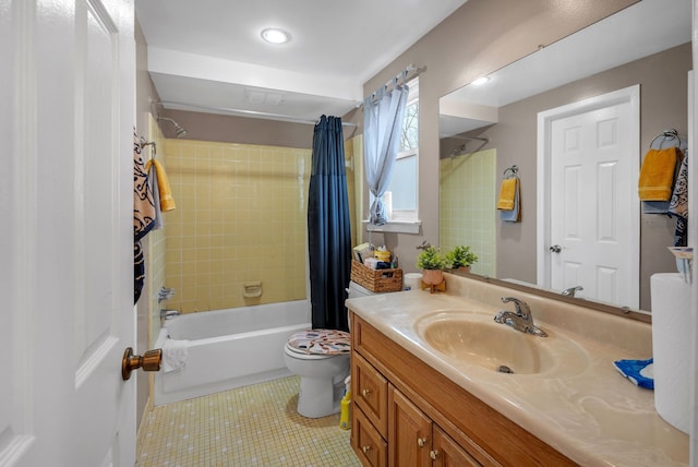 bathroom featuring shower / bathtub combination with curtain, toilet, vanity, and tile patterned flooring