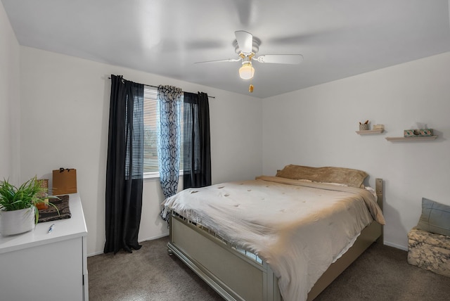 bedroom with light carpet, baseboards, and a ceiling fan