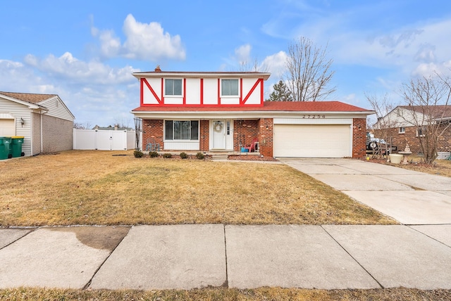 view of front of home with concrete driveway, a garage, brick siding, and a front lawn