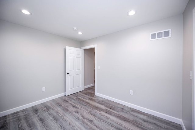 spare room featuring light hardwood / wood-style floors