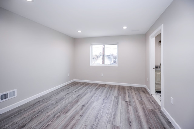 unfurnished room featuring light hardwood / wood-style flooring