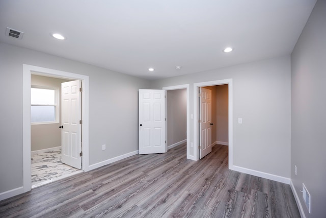 unfurnished bedroom with light hardwood / wood-style flooring