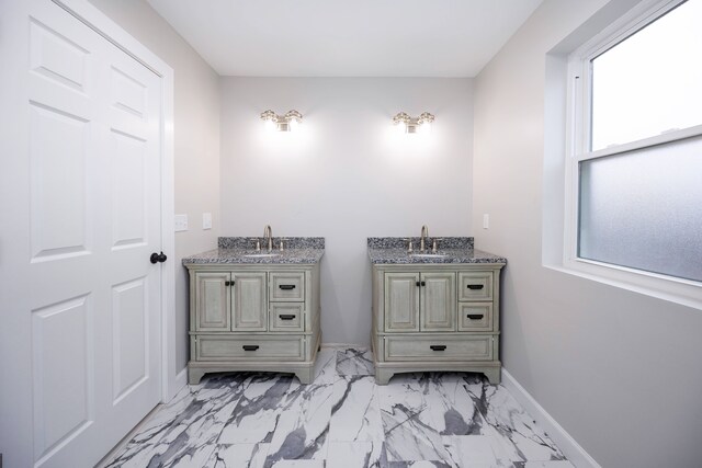 bathroom with vanity and plenty of natural light