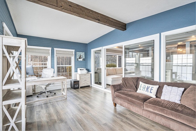 interior space featuring vaulted ceiling with beams