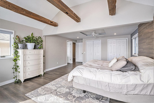 bedroom featuring ceiling fan, multiple closets, high vaulted ceiling, dark hardwood / wood-style flooring, and beamed ceiling