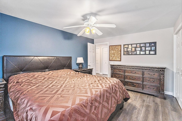 bedroom with ceiling fan and hardwood / wood-style floors