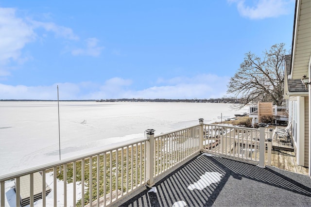 wooden terrace with a water view