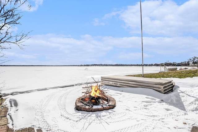 property view of water featuring an outdoor fire pit