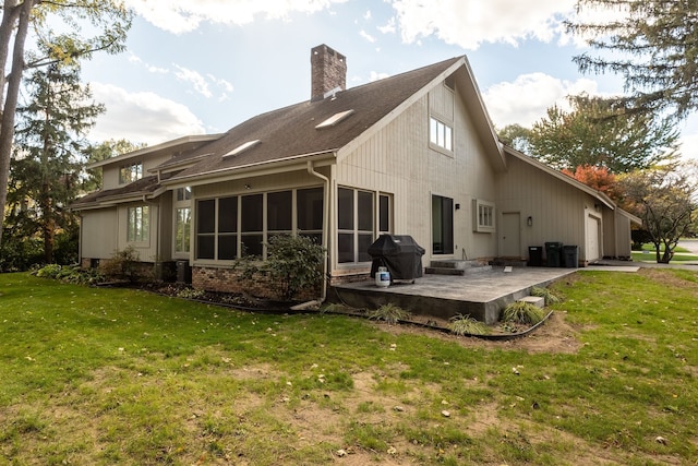 back of house with a yard and a patio area