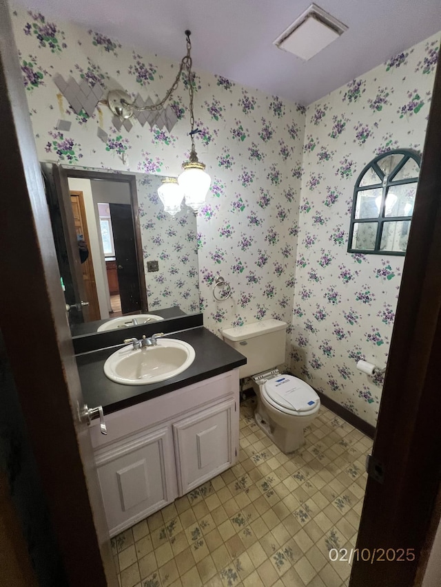 bathroom with vanity and toilet